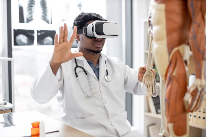African,American,Man,Wearing,Lab,Coat,And,3d,Goggles,Using