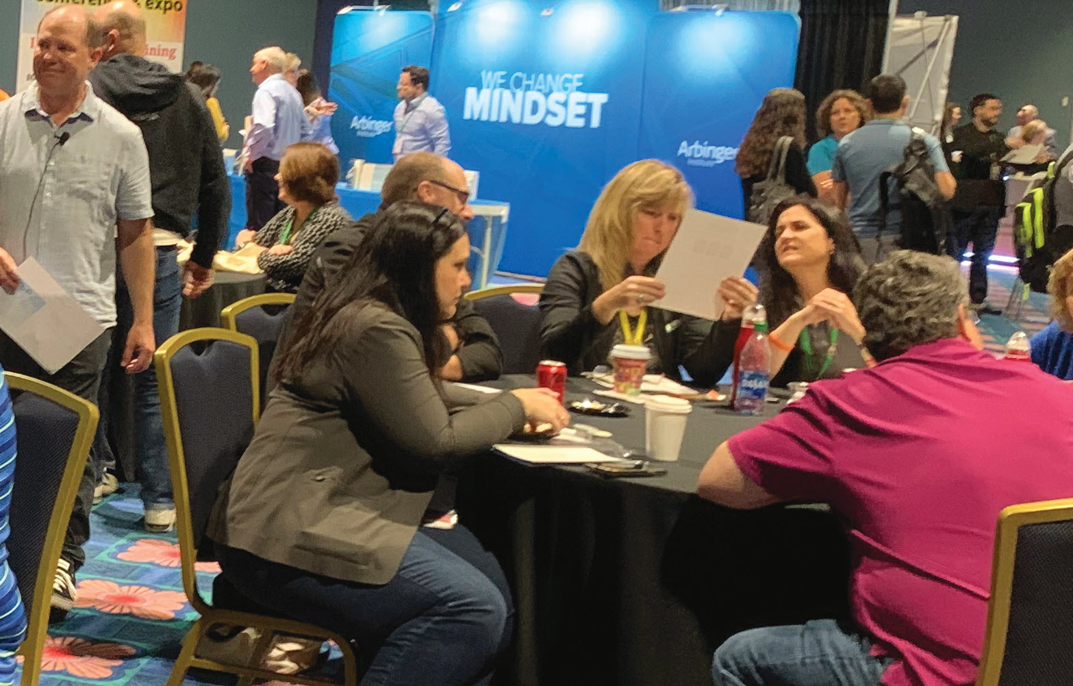Attendees spend time networking and collaborating in groups.