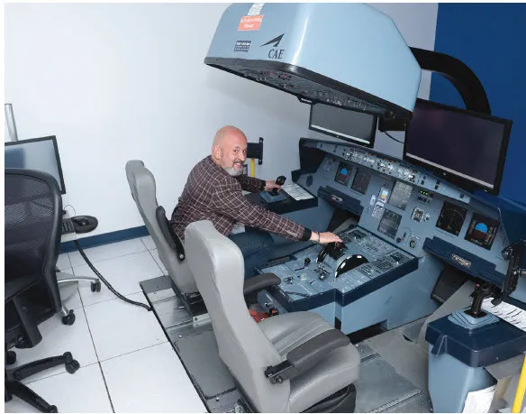 Taking a turn at the controls in a flight training device.
