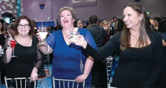 A toast to the winners. PHOTOGRAPHY BY HUGHES FIORETTI PHOTOGRAPHY